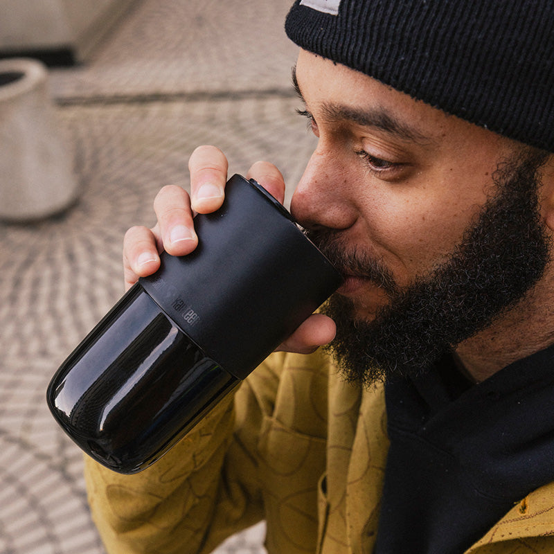 16oz-rise-tumbler-m5 16oz_rise_tumbler_black_man_drink_square.jpg