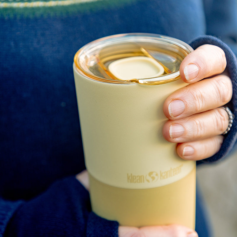 daily-on-the-go-set-j7 16oz_rise_tumbler_wax_yellow_closeup_hand_lid_square.jpg
