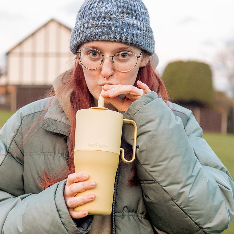 26oz-rise-tumbler-with-straw-lid-u6 26oz_rise_rumbler_straw_wax_yellow_woman_sip_square.jpg